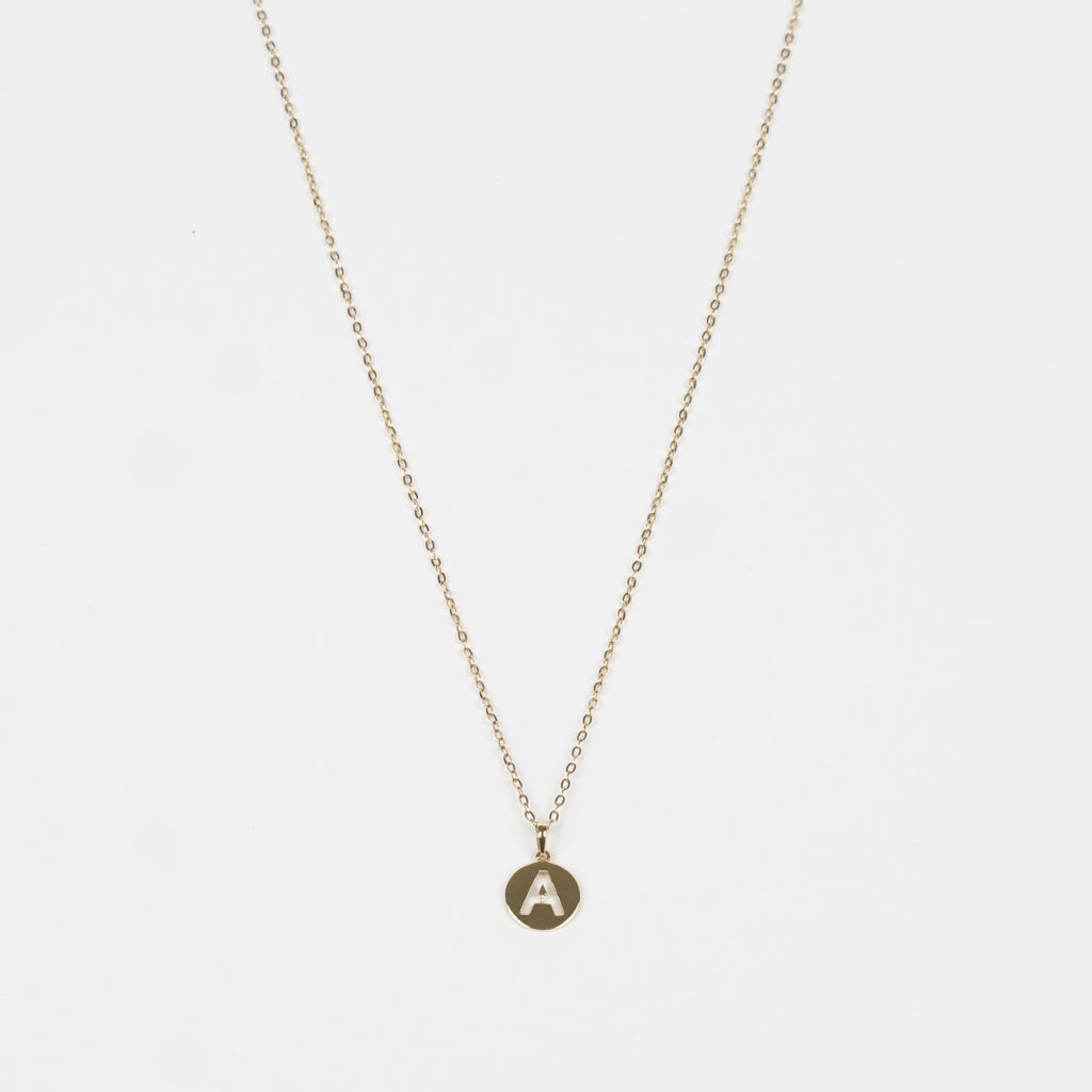 This charming piece is an effortlessly stylish Pure 18k Gold Necklace plus a Pure 18k Gold disc with a letter of the alphabet beautifully cut through the disc.
